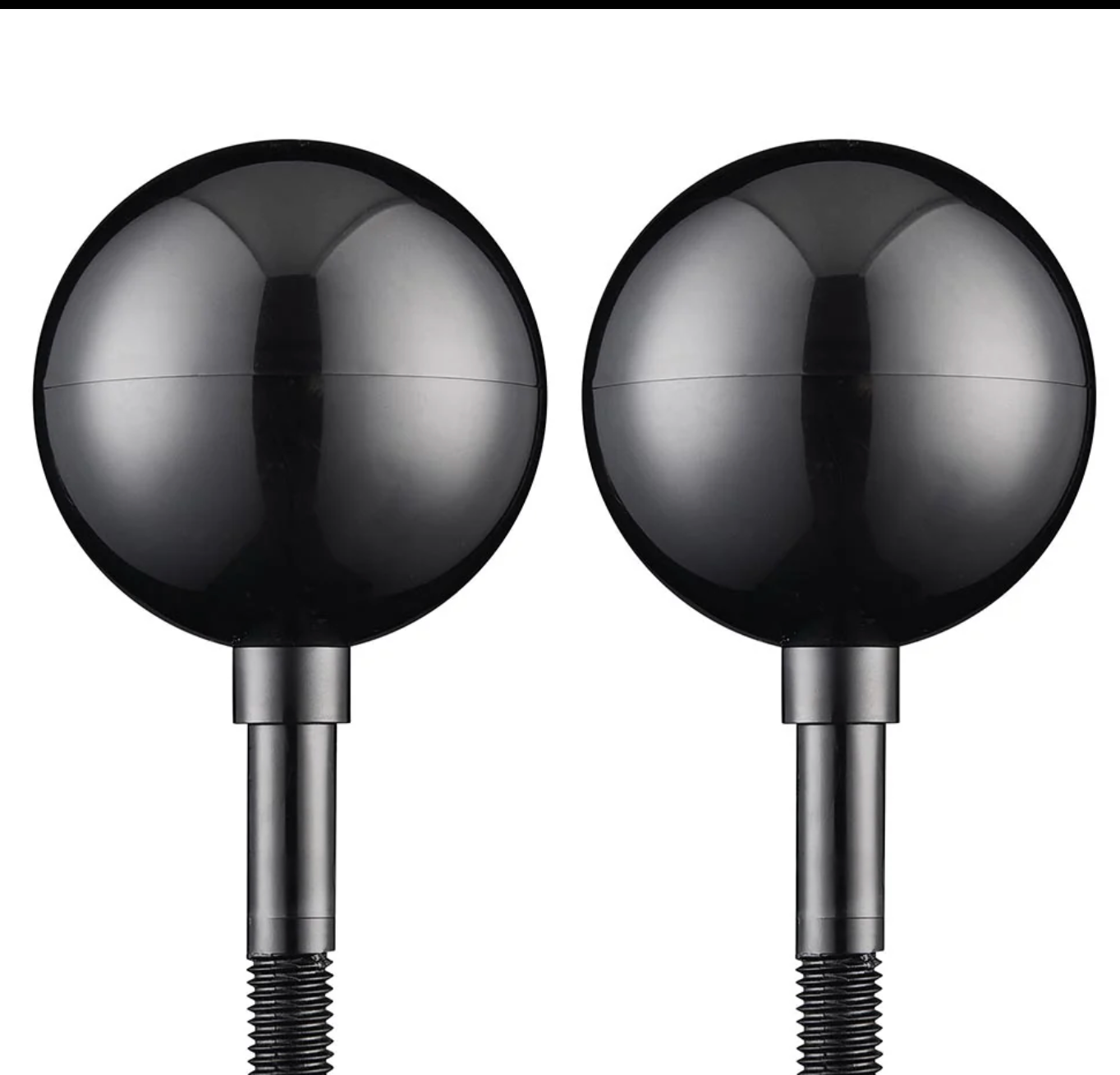 Two metallic spherical objects on cylindrical stands against a white background